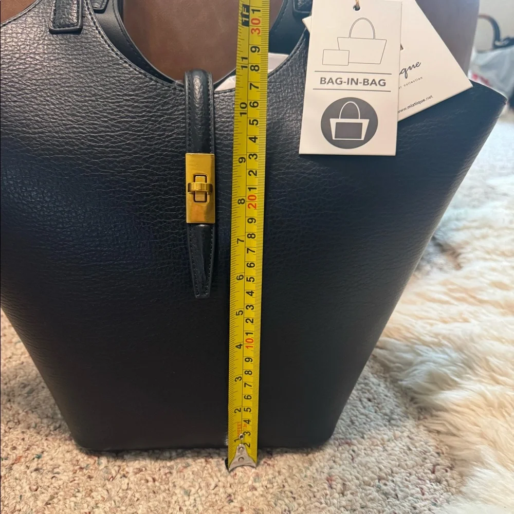 Miztique Black leather tote bag with gold hardware. Compartment bag.